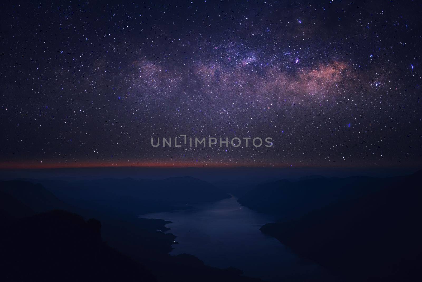 Clearly Milky way above the lake and mountain. Pha Dang Luang view point, Mae Ping National park.Thailand