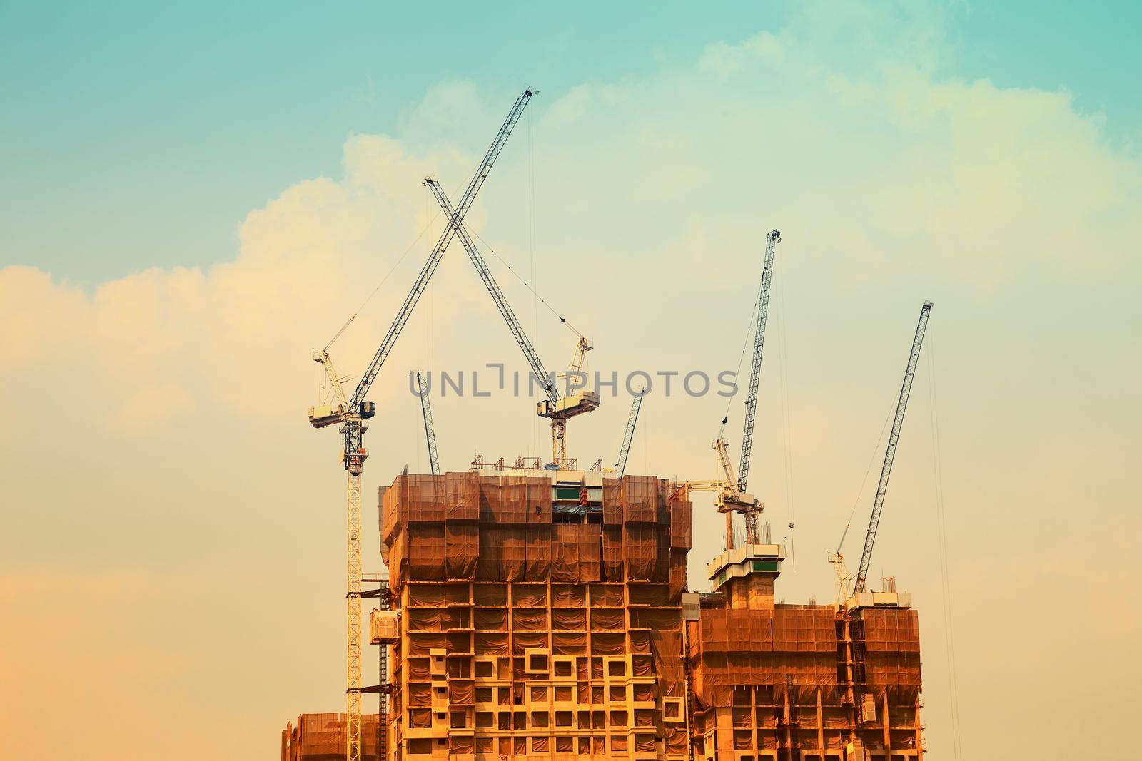 construction crane and the building against the blue sky