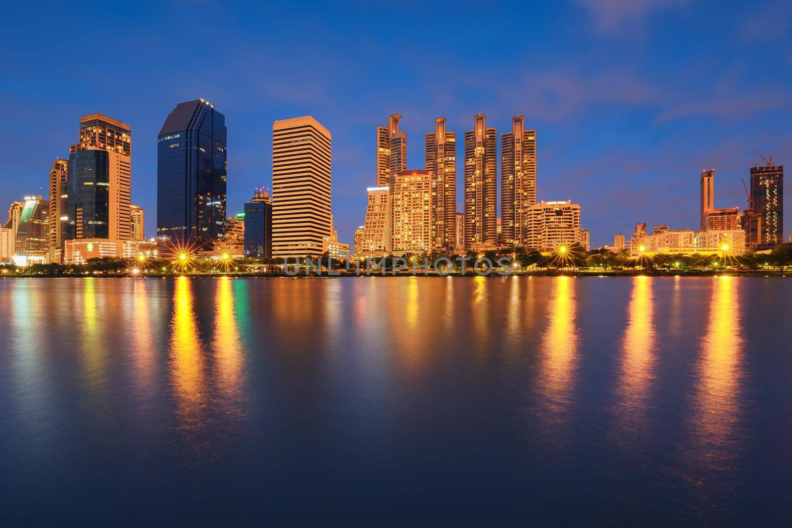 City building with water reflection in twilight