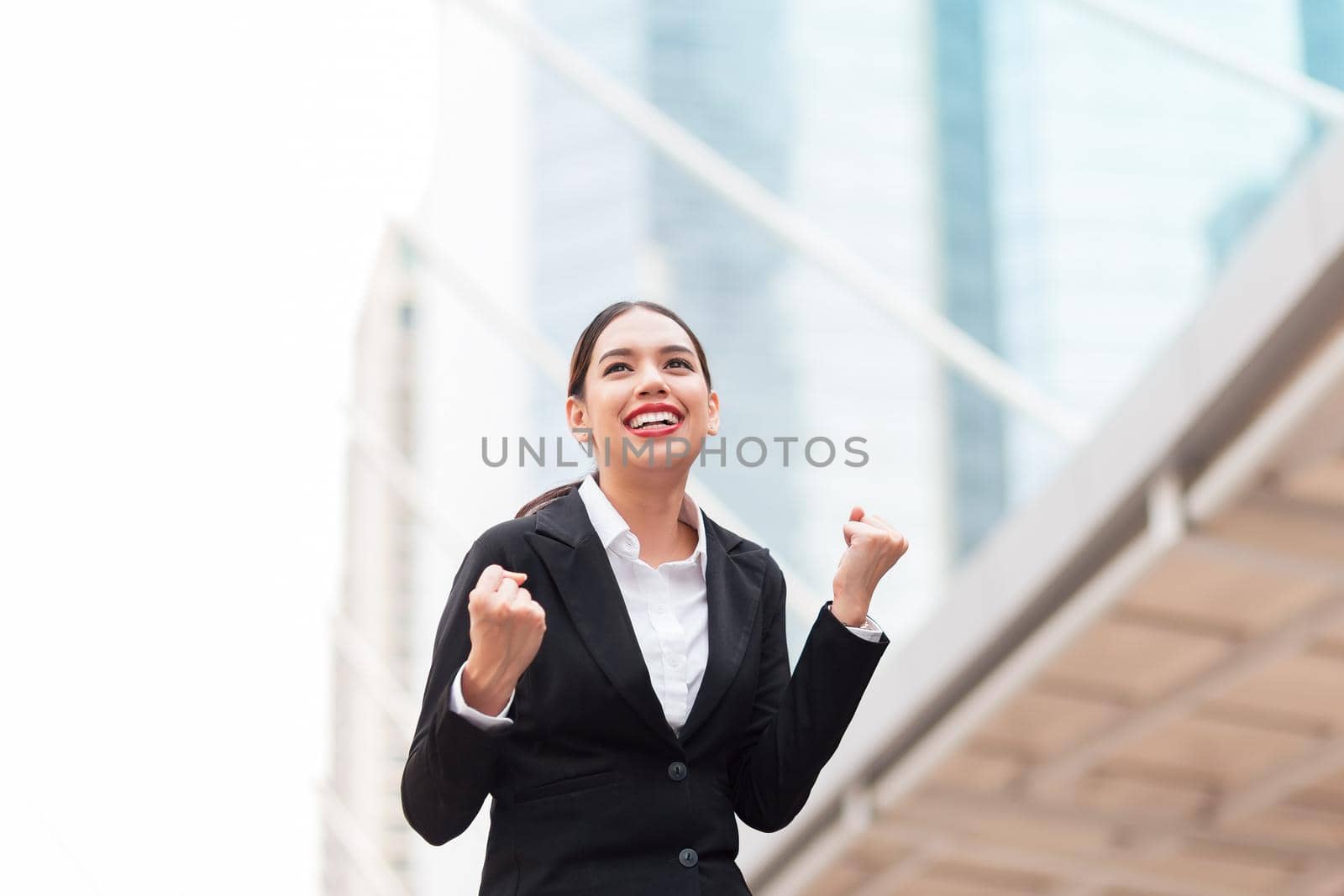 Young Business Woman celebrating a successful work day