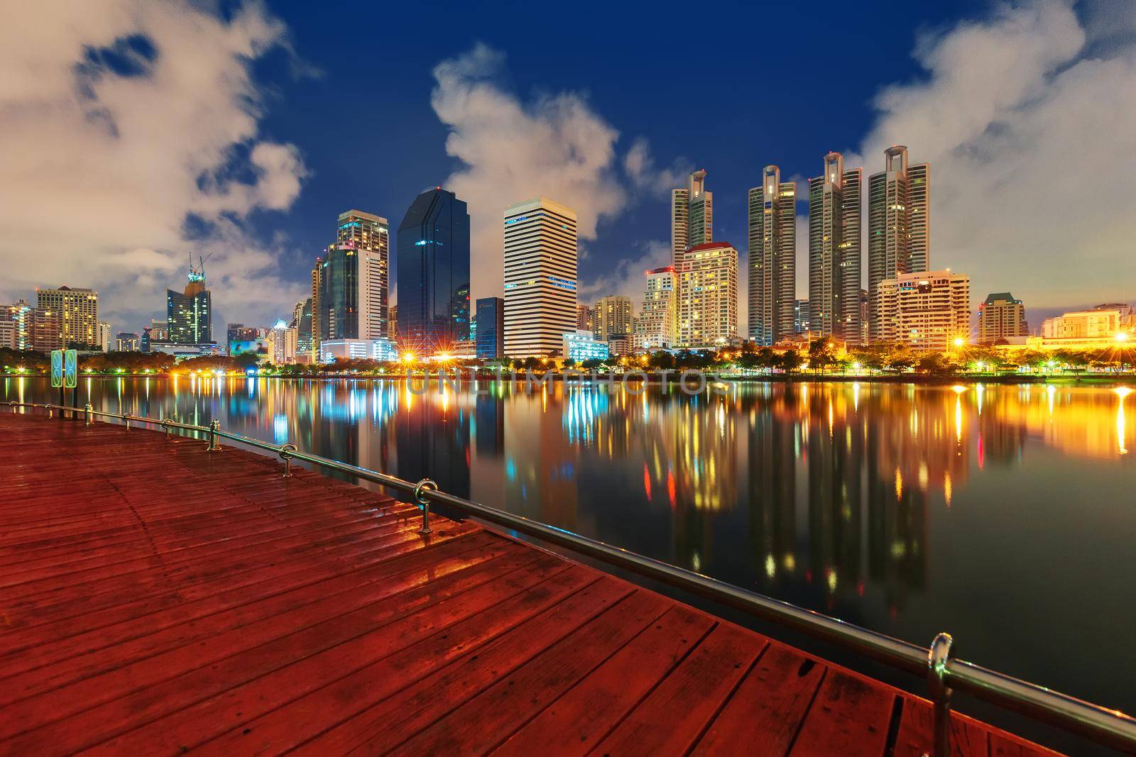 City building with water reflection in twilight