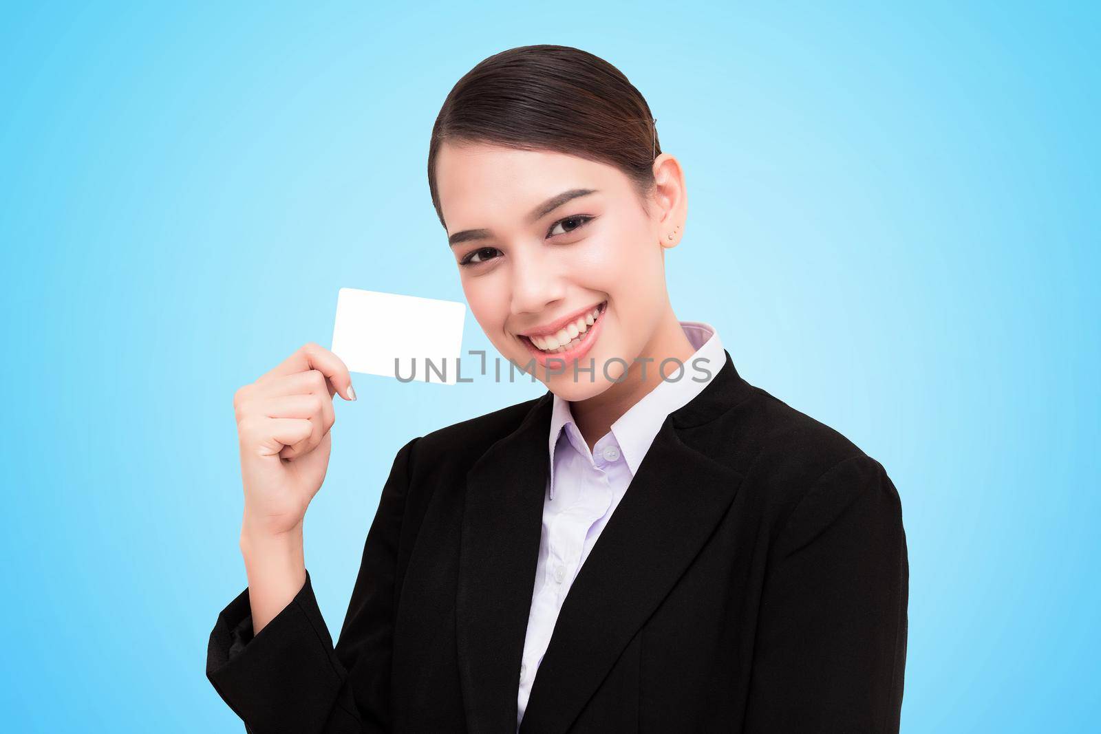 Smiling business woman show credit card.