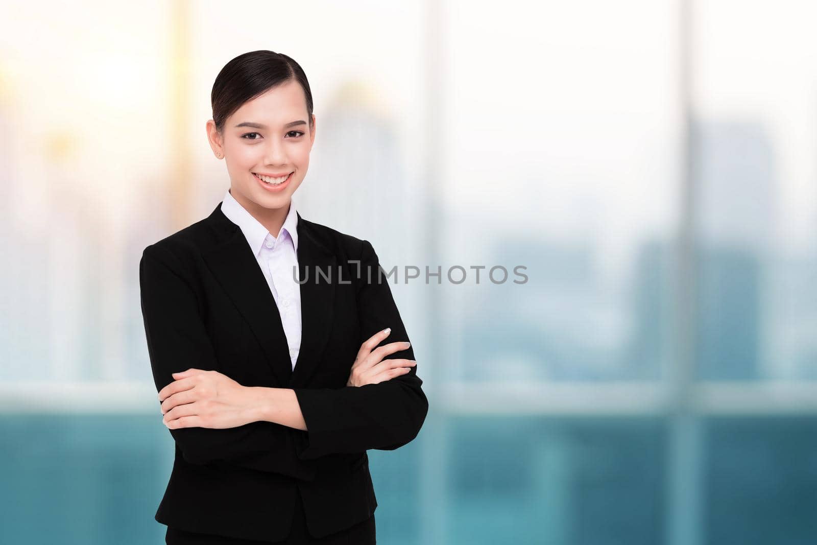 Smiling Pretty Business Woman With Arms Crossed