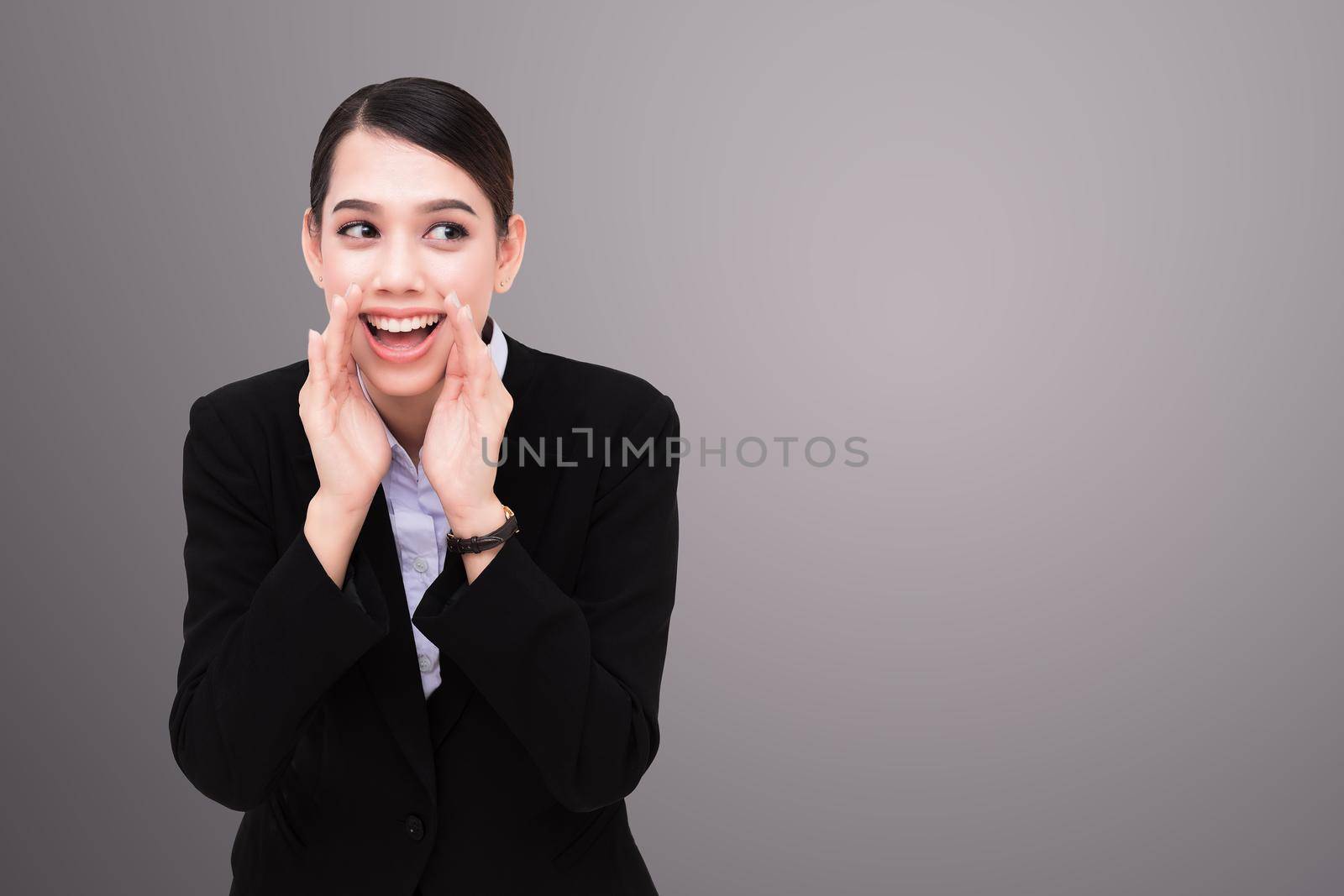 portrait of pretty businesswoman loud screaming or calling out to someone