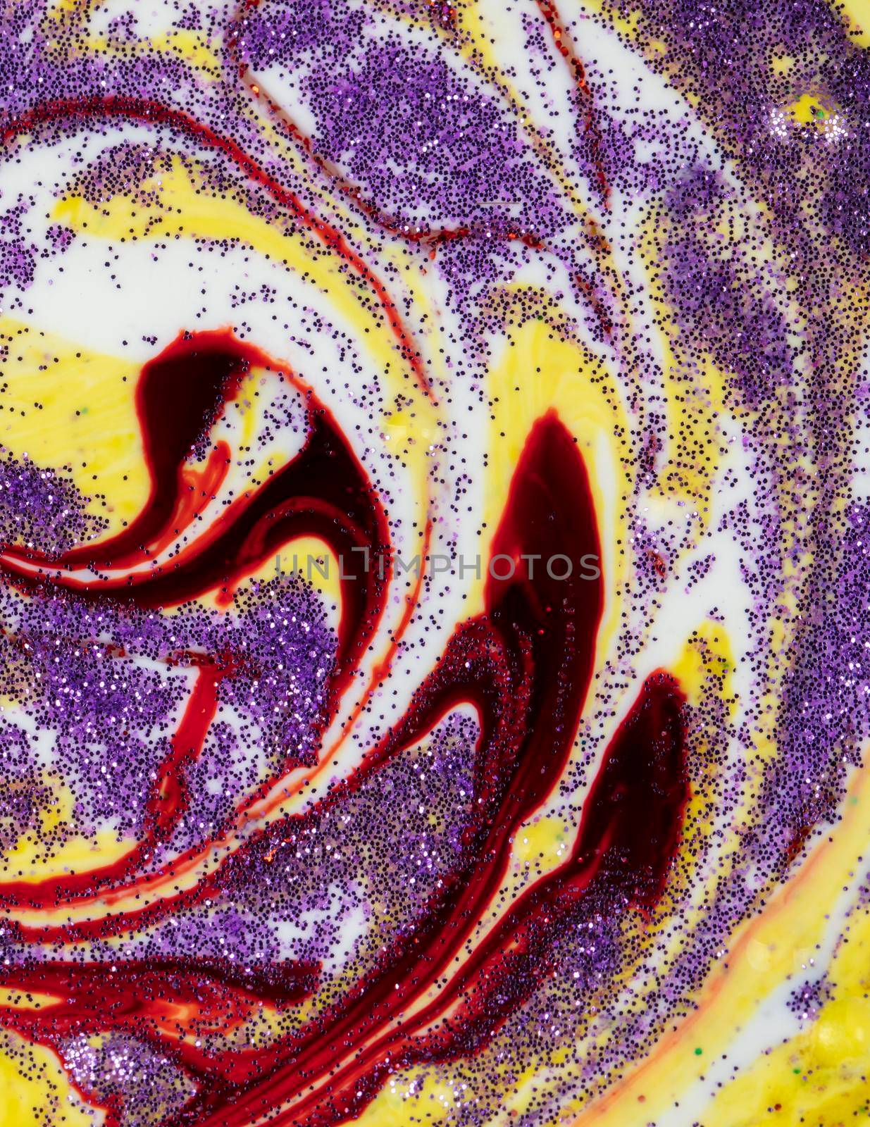 Yellow smeared in a circle with purple sparkles Abstract pattern with curls. Popular fashionable art design.