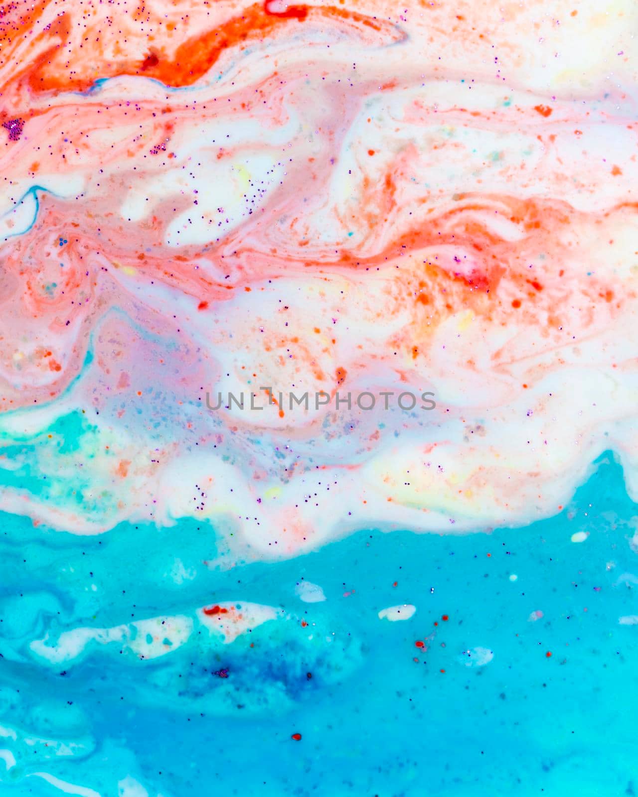 The background is acrylic soft blue with pink and sparkles. Colorful marble texture. Fluid liquid marble. Art picture. Avant-garde creativity.