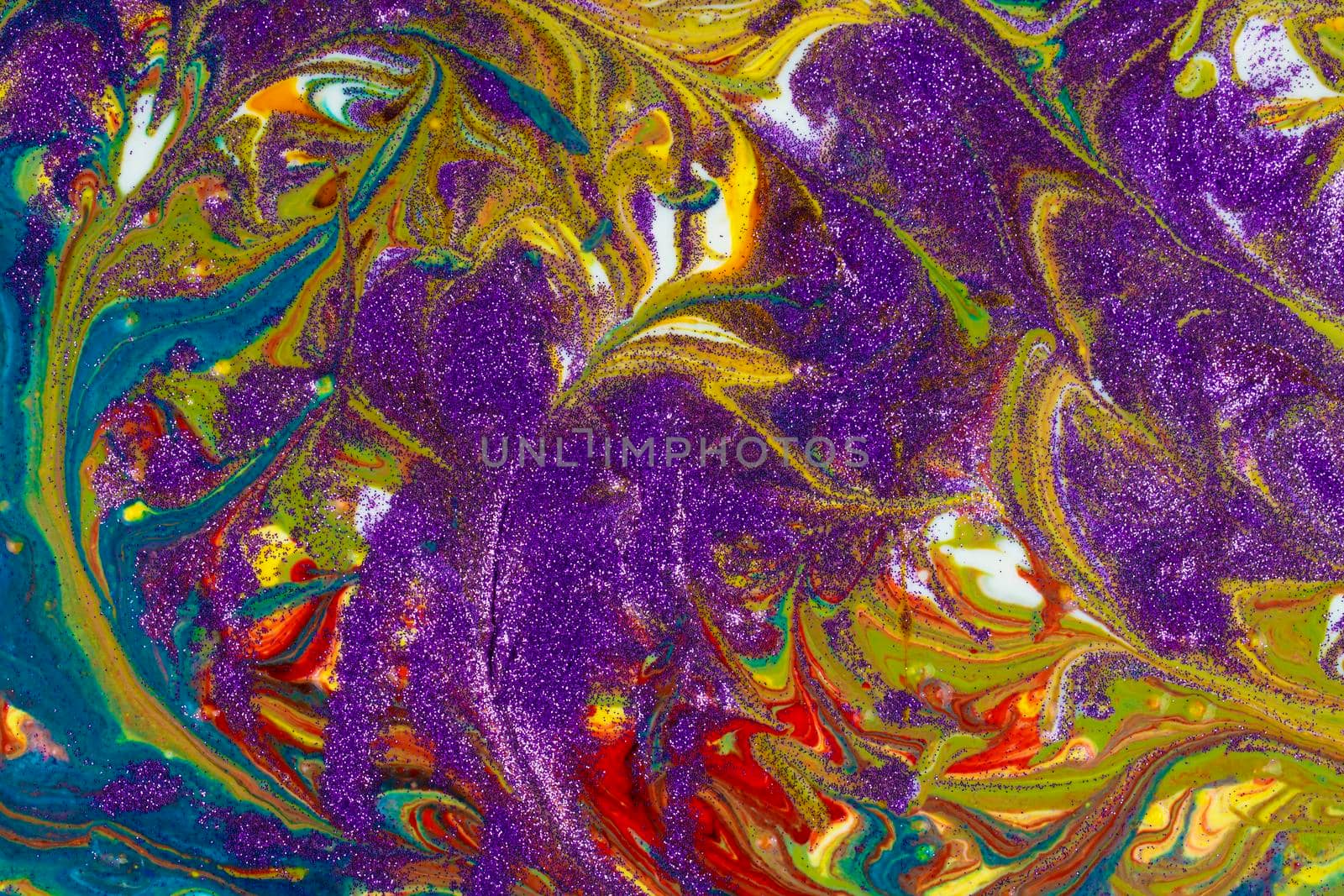 Multicolored acrylic backdrop sprinkled with purple sequins. Contemporary creativity. Colorful avant-garde texture. A background made up of many textures, shapes and materials.