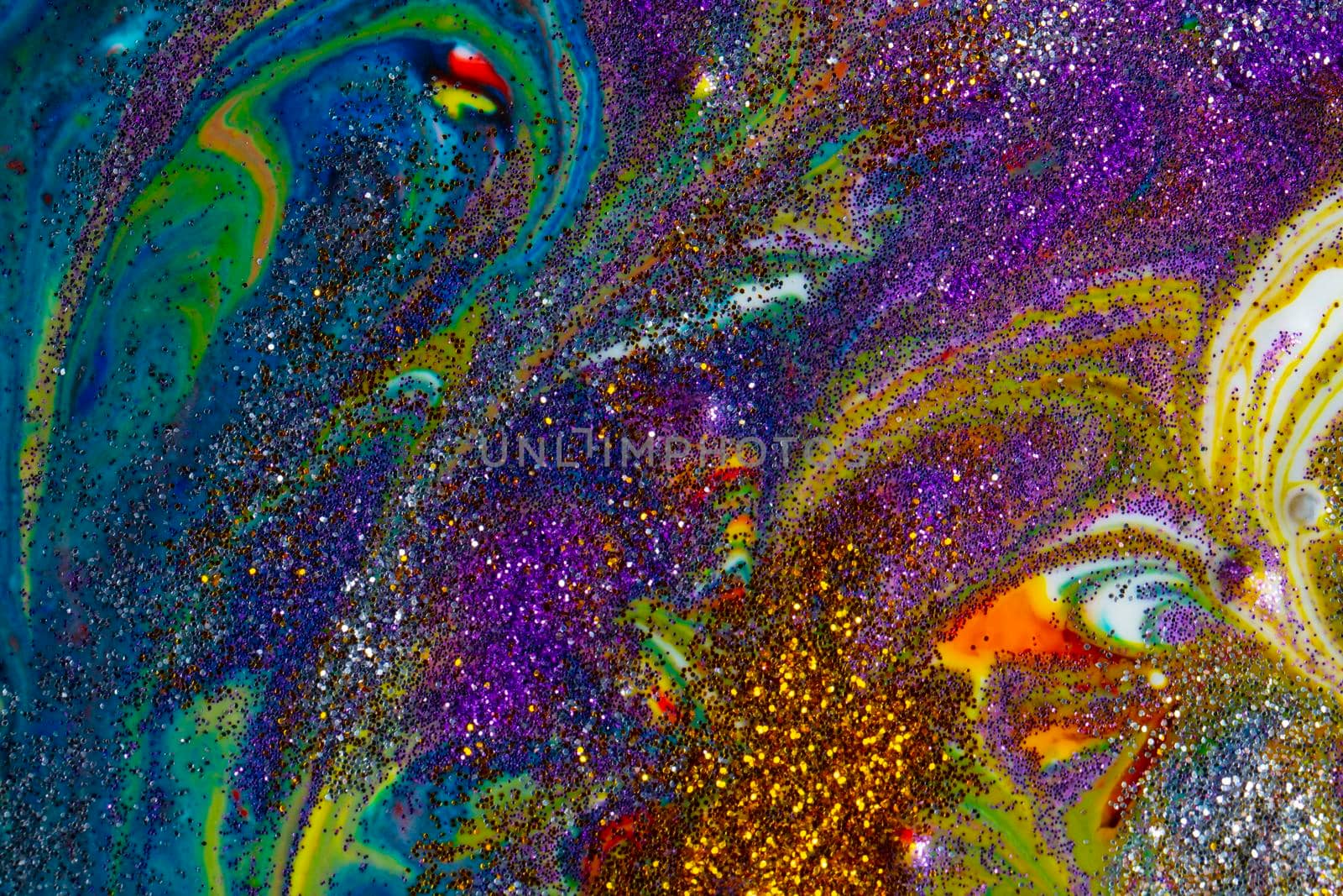 Multicolored acrylic backdrop sprinkled with purple sparkles. Contemporary creativity. Colorful avant-garde rich texture. A background made up of many shapes and materials.
