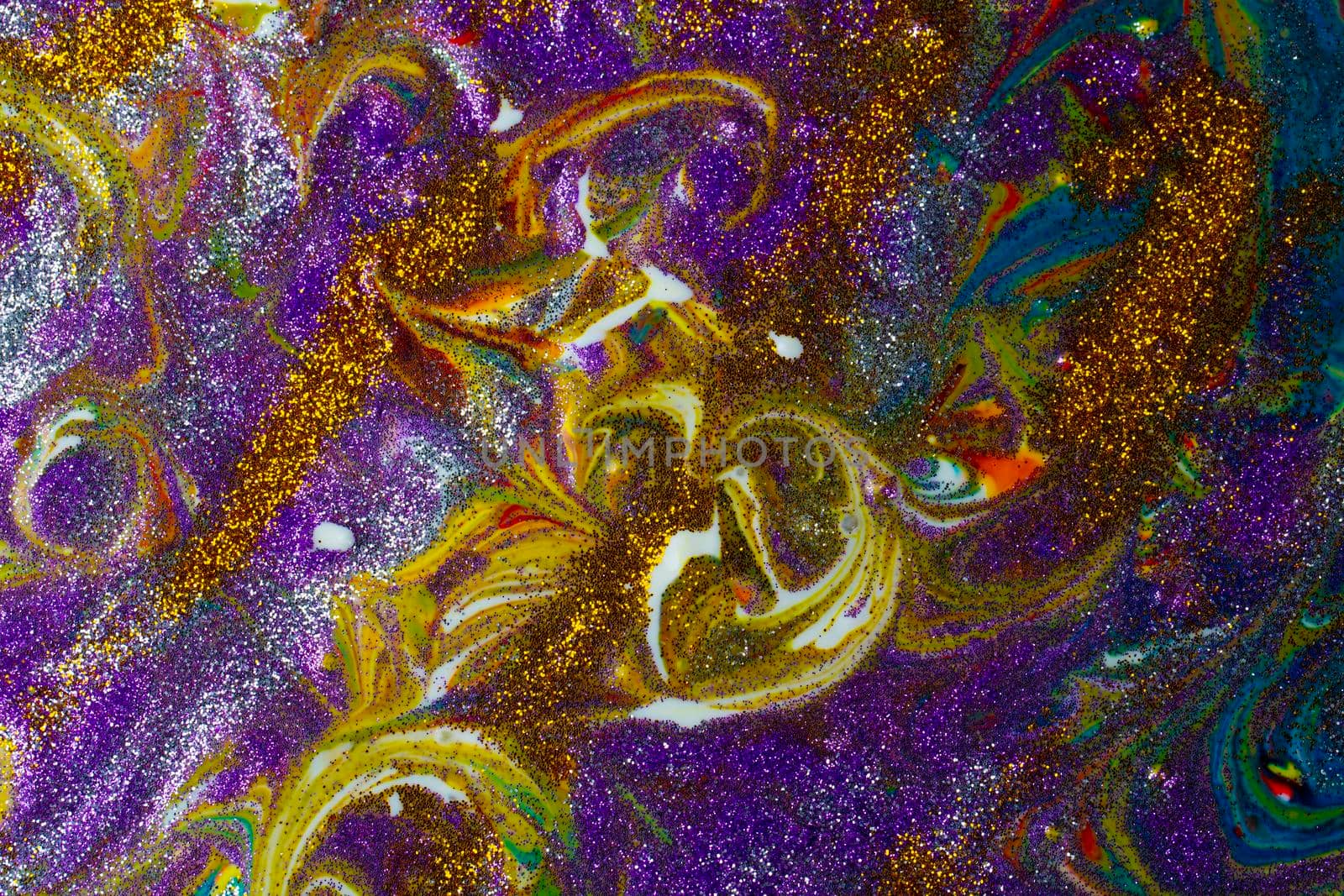Multicolored acrylic background with curls sprinkled with purple and gold sparkles. Contemporary creativity. A colorful avant-garde painting with rich texture. A background made up of many shapes and materials.