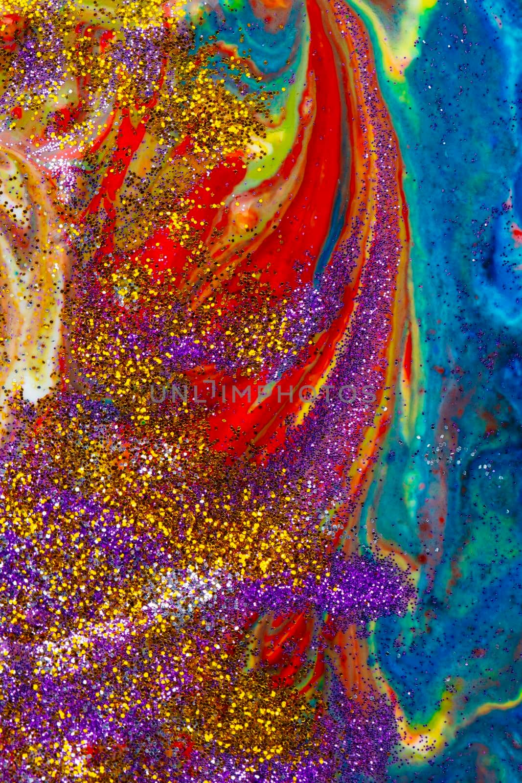 Multicolored vertical acrylic backdrop sprinkled with purple and gold sparkles. Contemporary creativity. A colorful avant-garde painting with rich texture. A background made up of many shapes and materials.