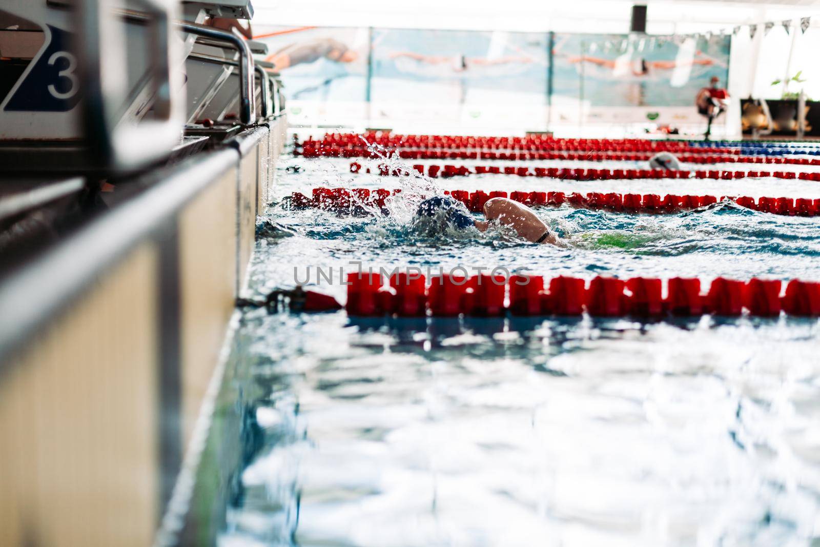 Swimming to the target during the race at the pool.