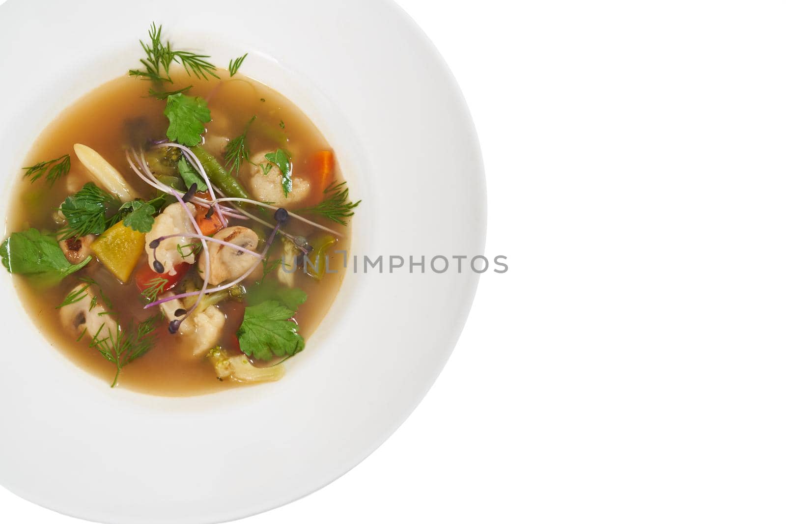 Modern white plate with delicious vegetables soup.  by SerhiiBobyk
