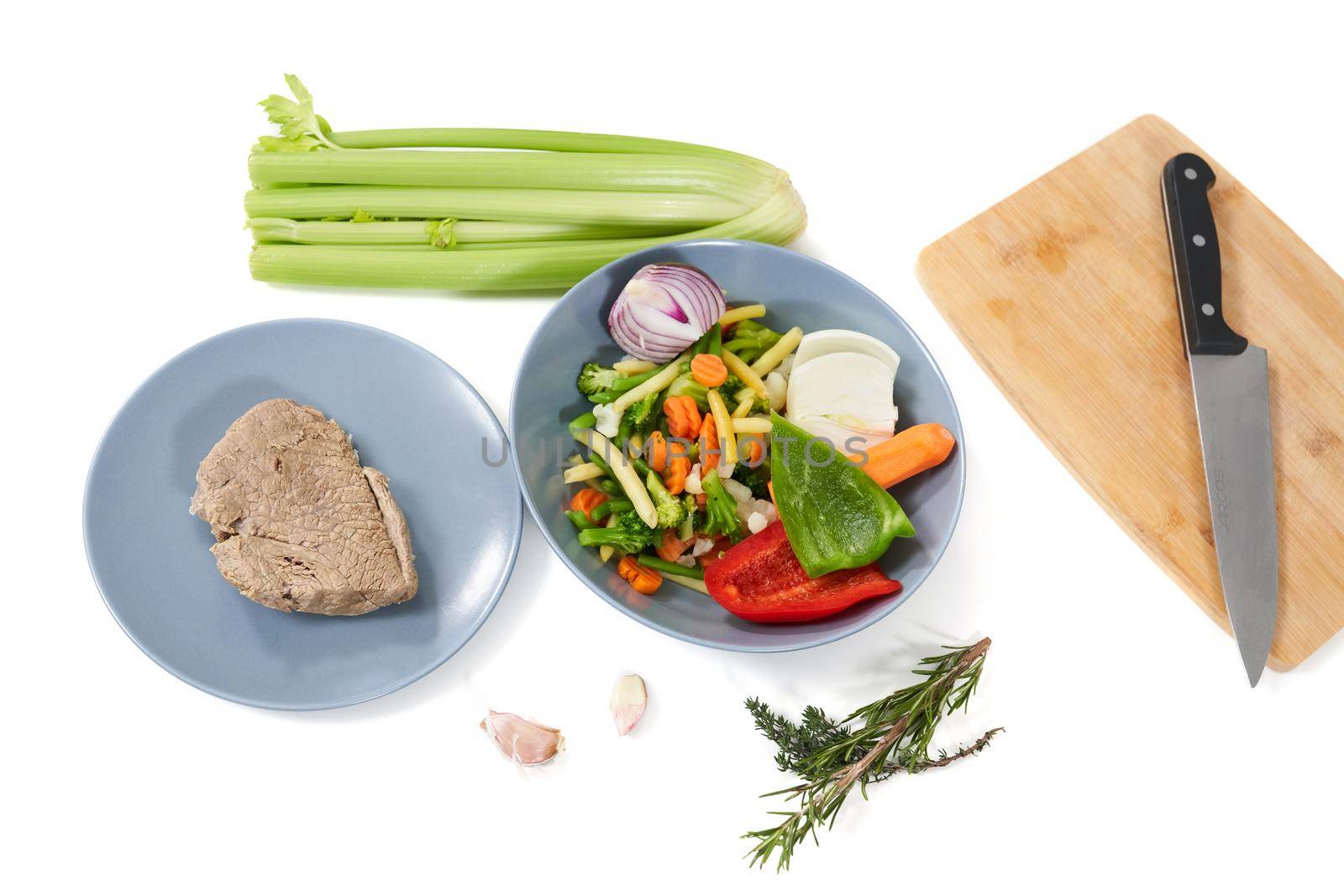 Top view close up of two plate with boiled vegetables and meat for cooking delicious meal. Concept of process cooking yummy dish with appetizing ingredients at home. 