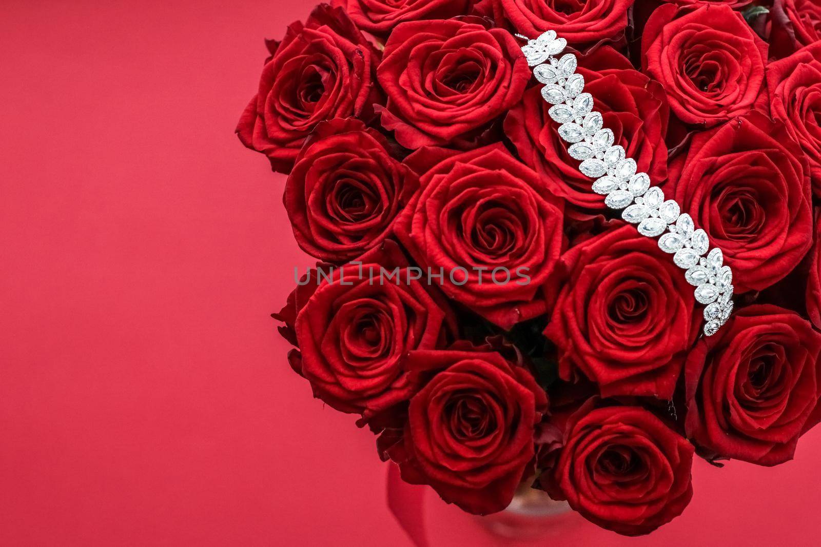 Gemstone jewellery, wedding fashion and luxe shopping concept - Luxury diamond bracelet and bouquet of red roses, jewelry love gift on Valentines Day and romantic holidays present