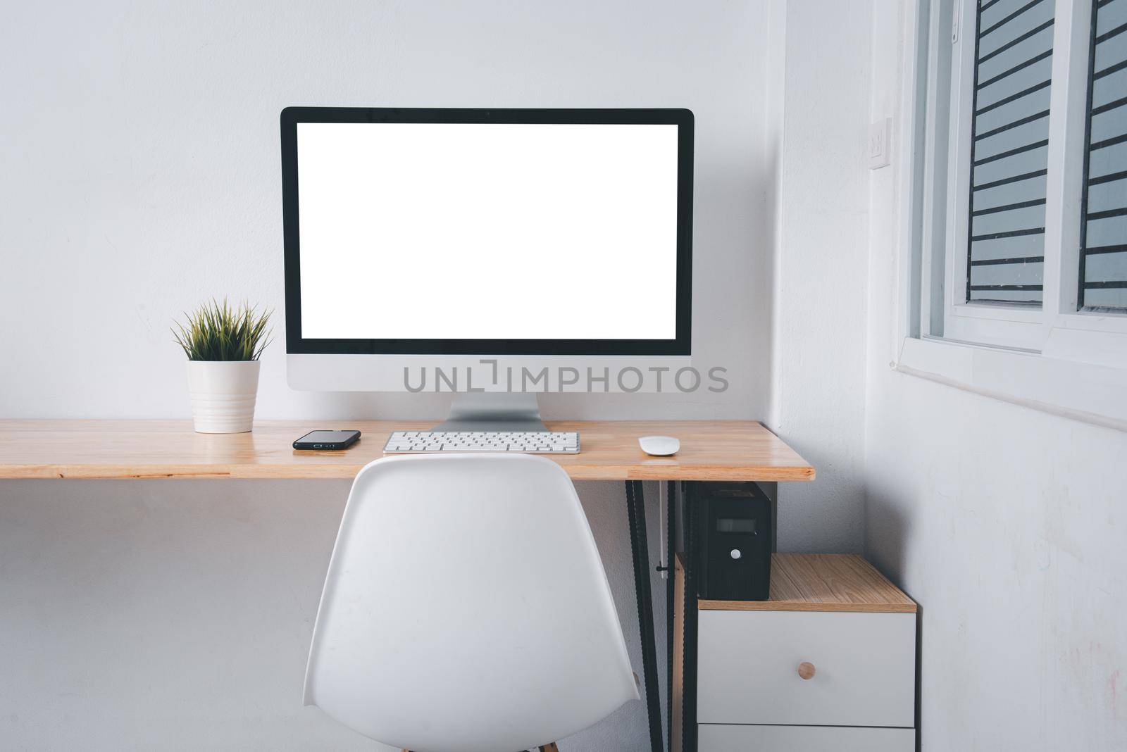 Computer monitor with white blank screen on the business desk by Sorapop