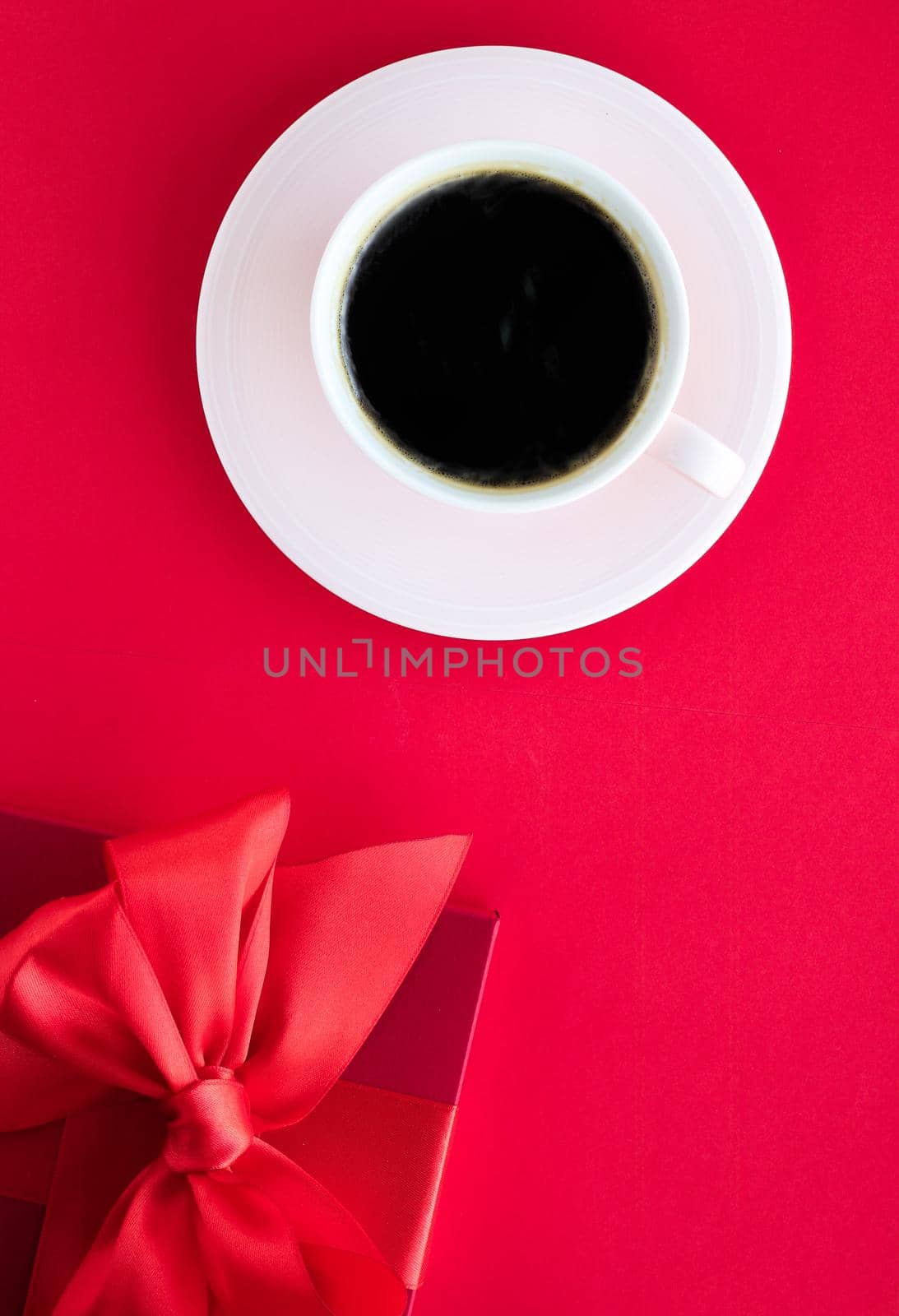 Romantic celebration, lifestyle and birthday present concept - Luxury beauty gift box and coffee on red, flatlay