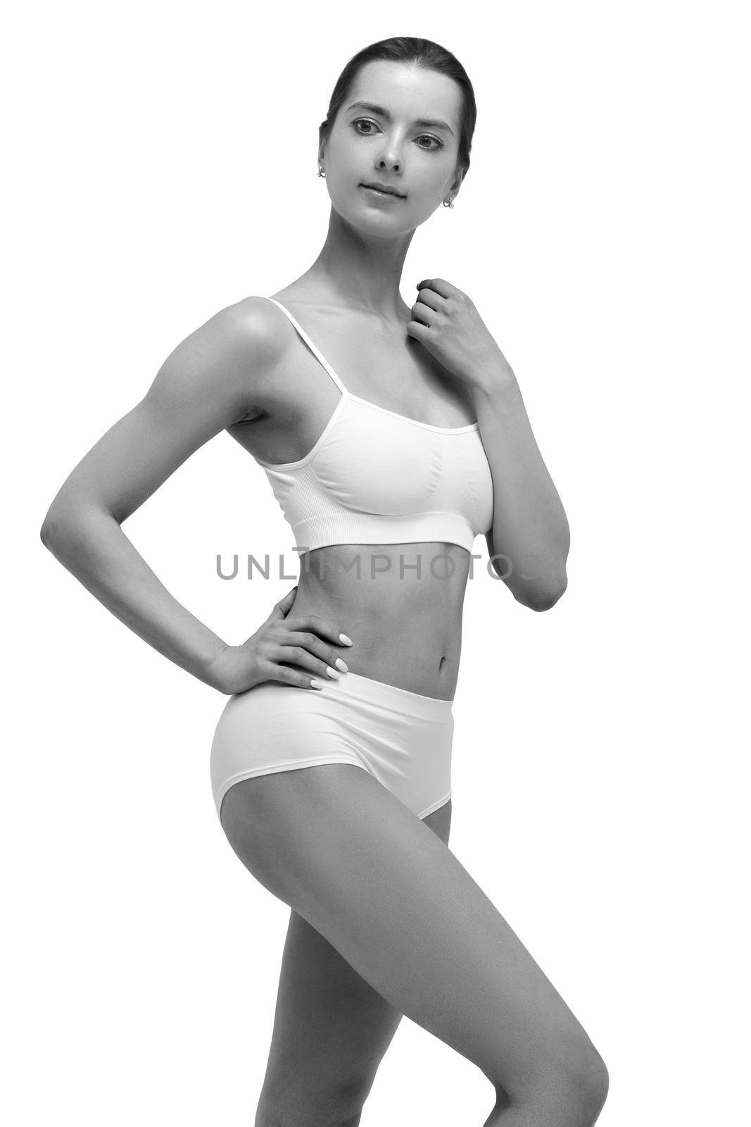 Beautiful slim woman in white lingerie by Nobilior