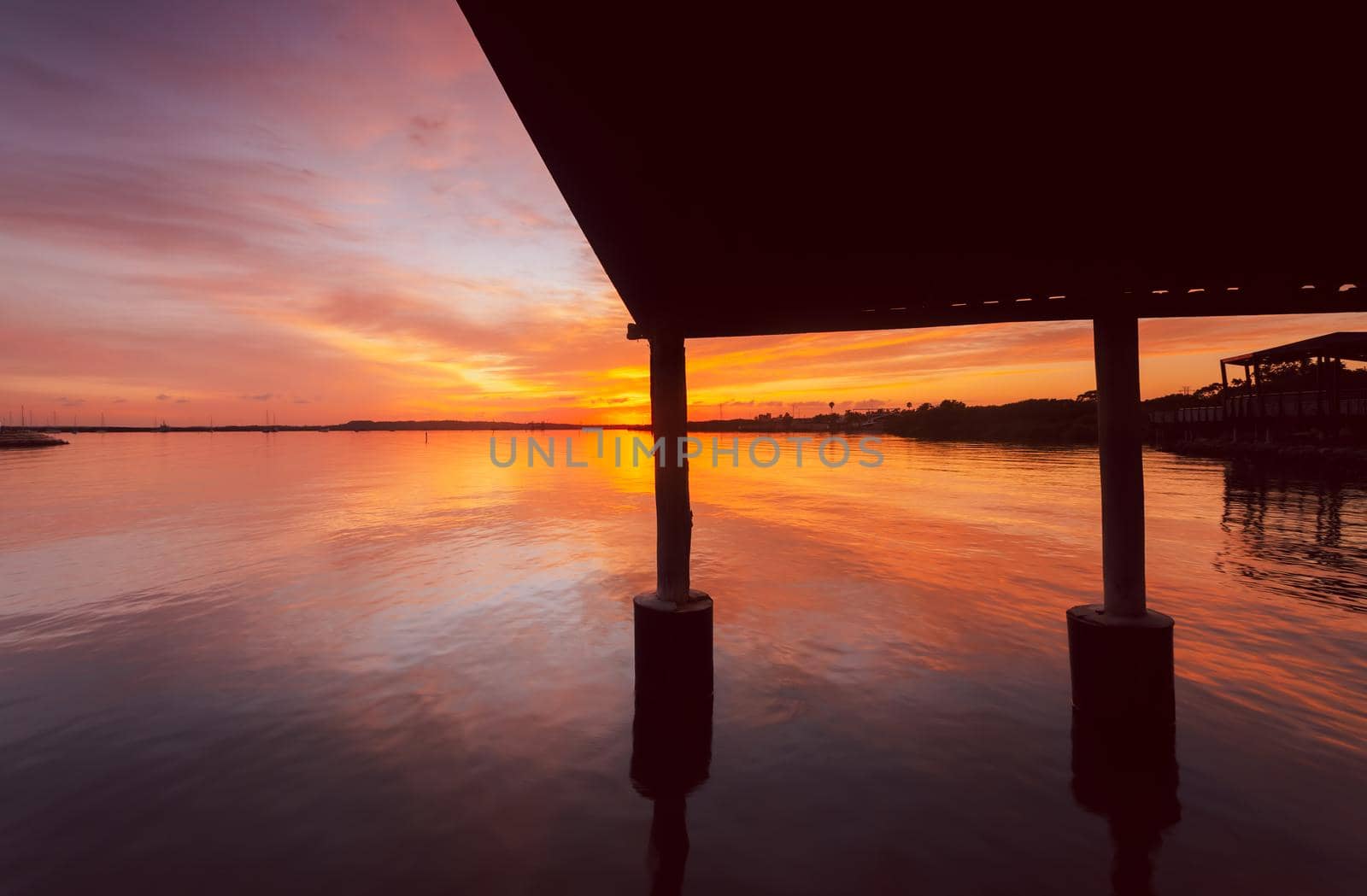 Sensational sunrise sky reflecting in the water and views from the jetty