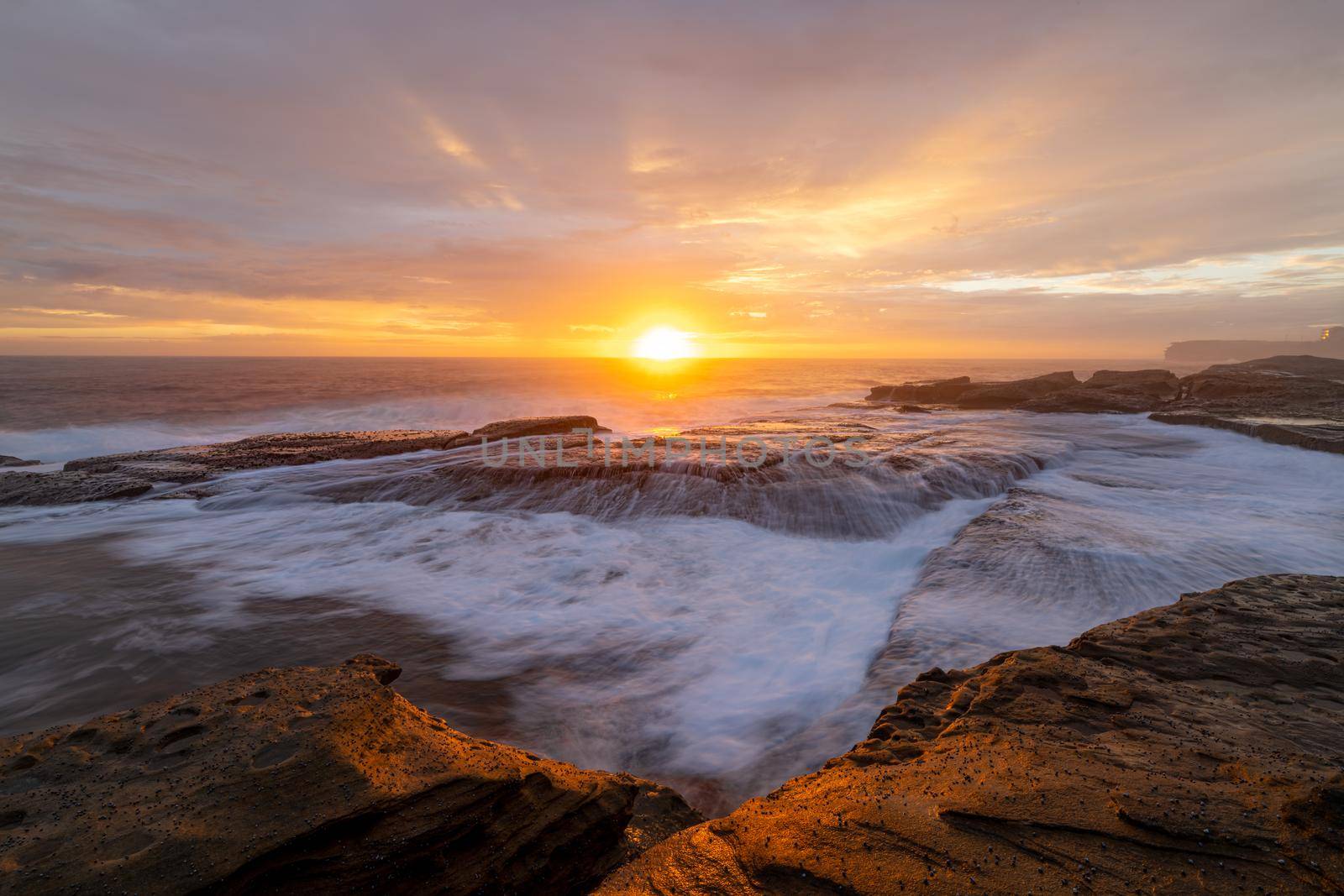 Beautiful sunrise over the ocean at South Coogee Australia by lovleah