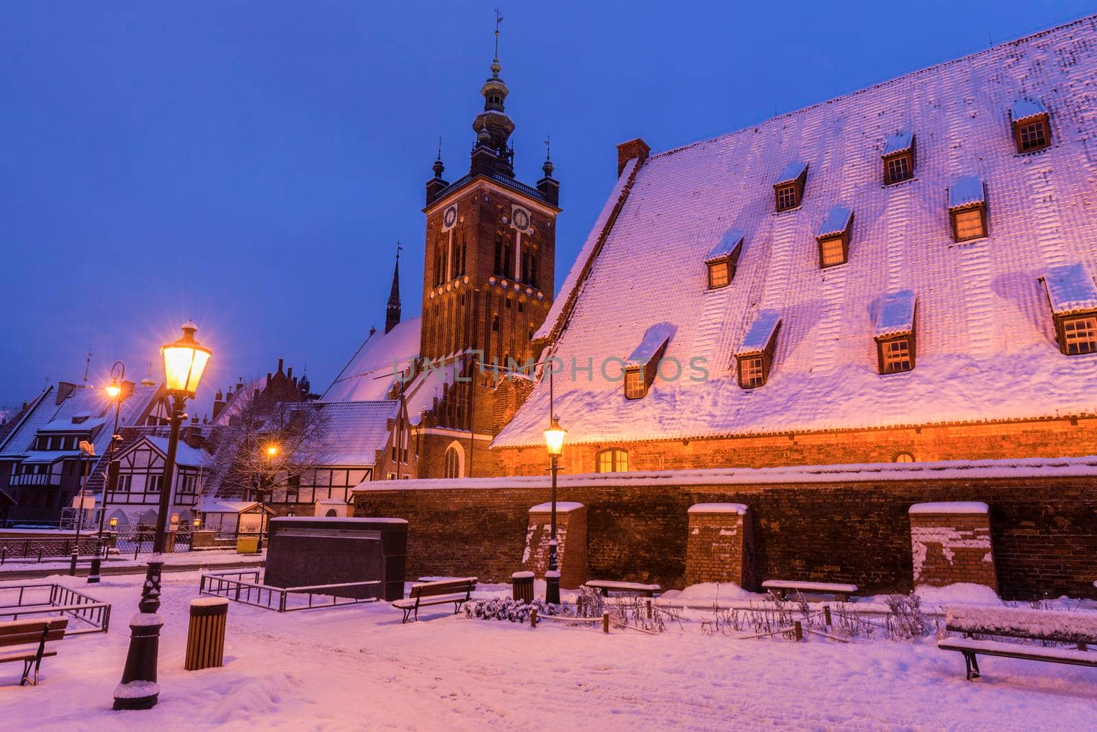 Great Mill in Gdansk and church at night. Gdansk, Pomerania, Poland.