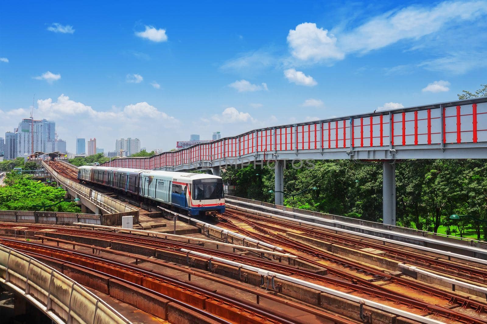 Trains traveling on elevated rails of System Thailand, Bangkok mass rapid train travels on the track.