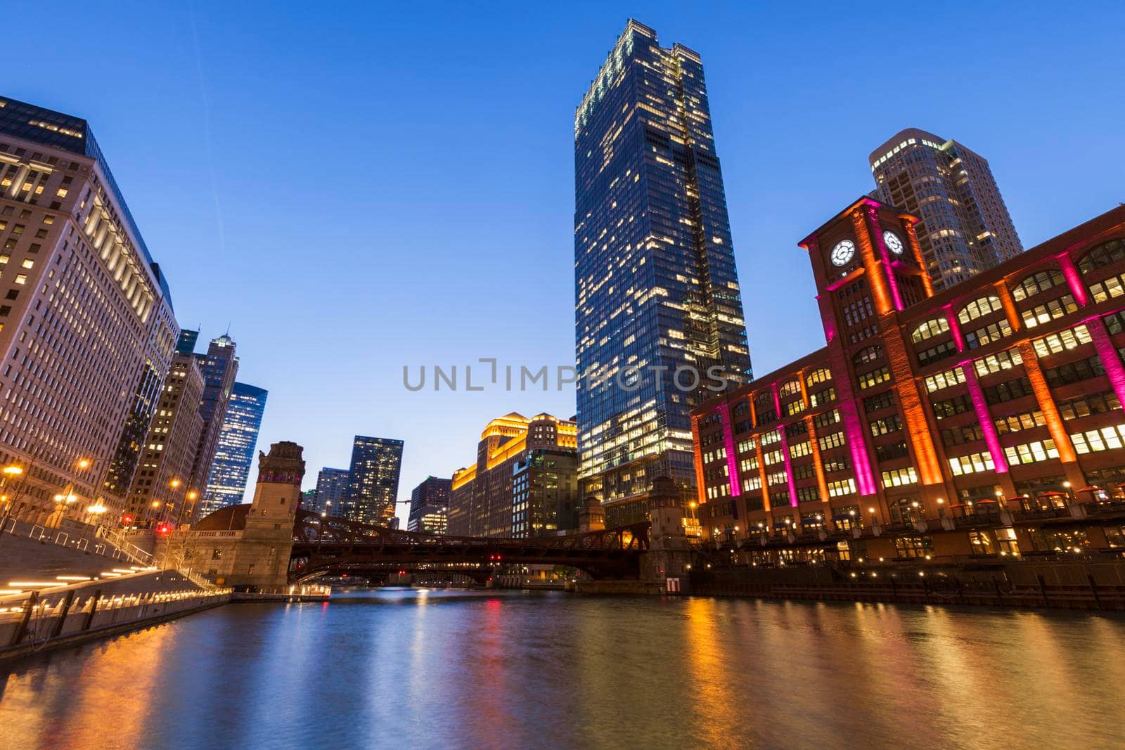 Colorful architecture of Chicago along Chicago River at night. Chicago, Illinois, USA.