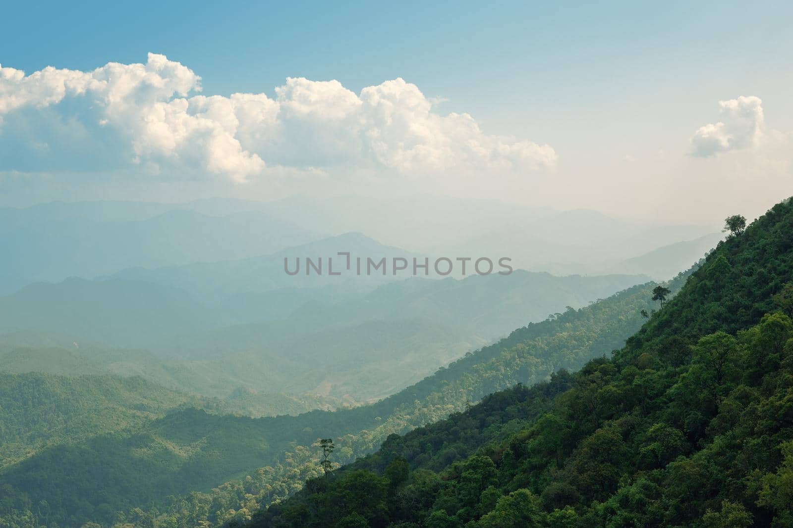 The blue sky and cloudy over the mountain in day