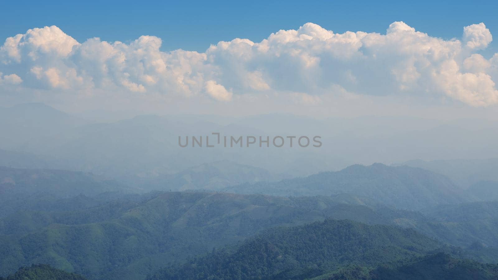 The blue sky and cloudy over the mountain in day