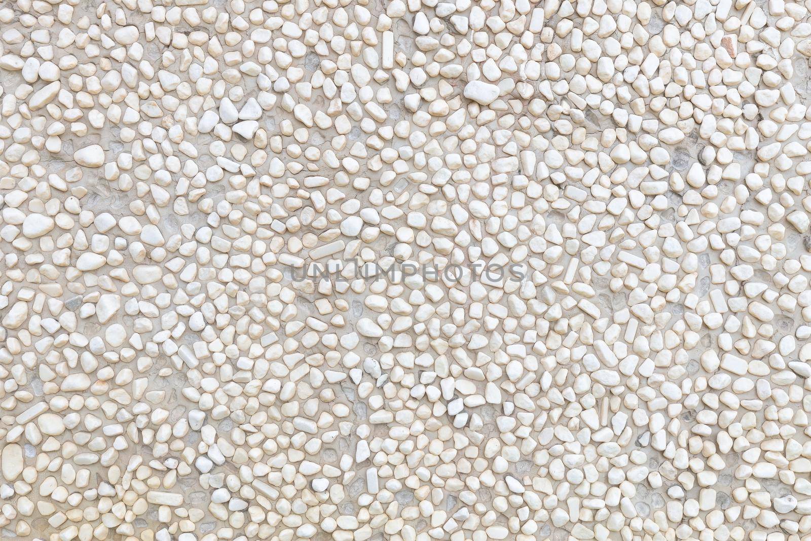 White wall surface Decorated with circular stones