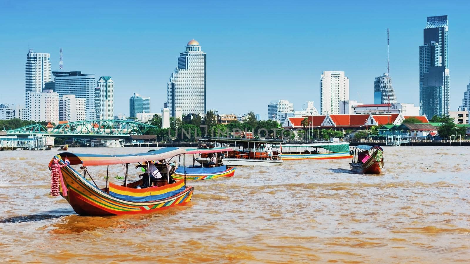 Long-tail boats in Chao Phraya river in Bangkok, Thailand. Image with selective focus