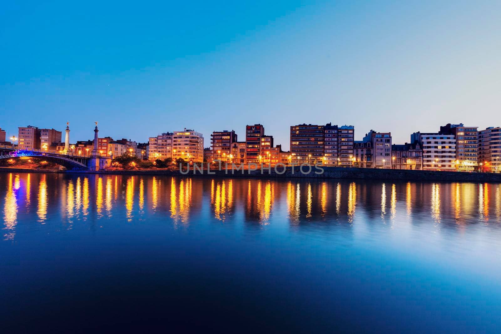 Panorama of Liege along Meuse River seen at evening. Liege, Wallonia, Belgium.