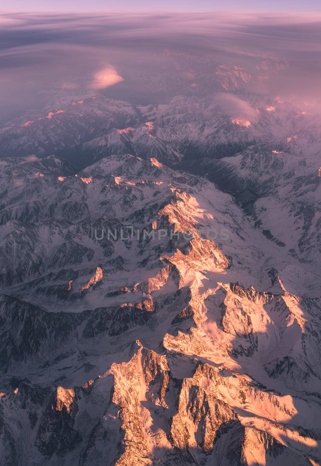 Clouds and sunset plane window view in Caucasus