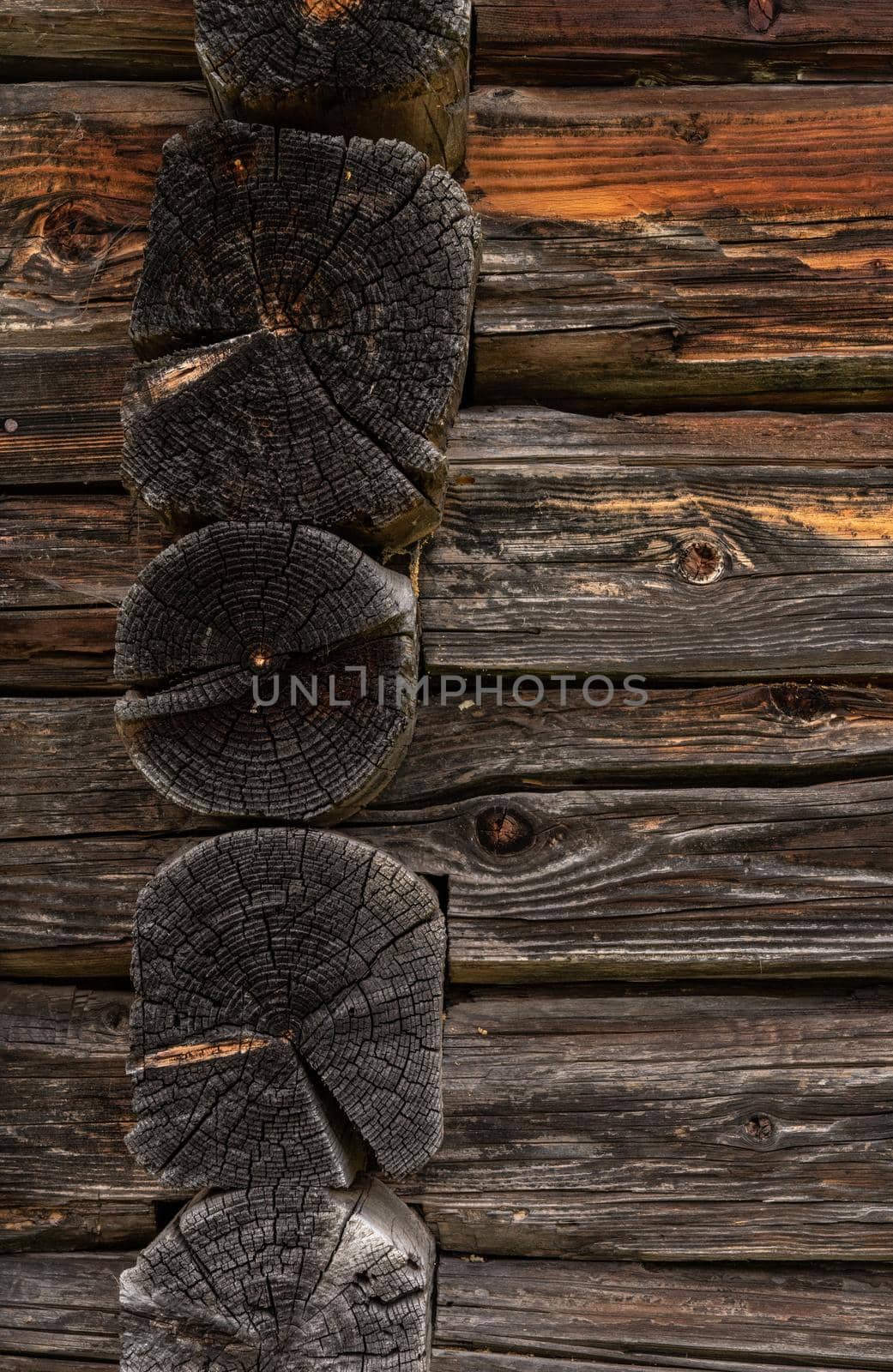 Wooden log cabin or felling  Rustic texture or background. Aged wood wall and boards