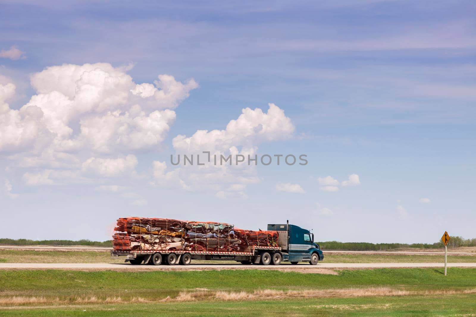 Transporting wrecked cars. Regina, Saskatchewan, Canada.