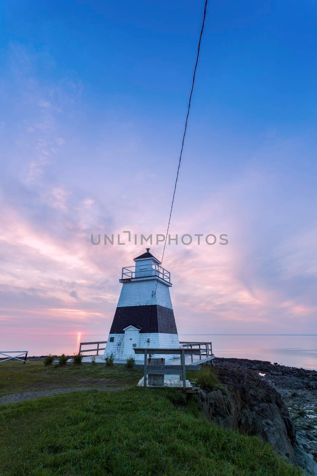 Margaretsville Lighthouse at sunset. Nova Scotia, Canada.