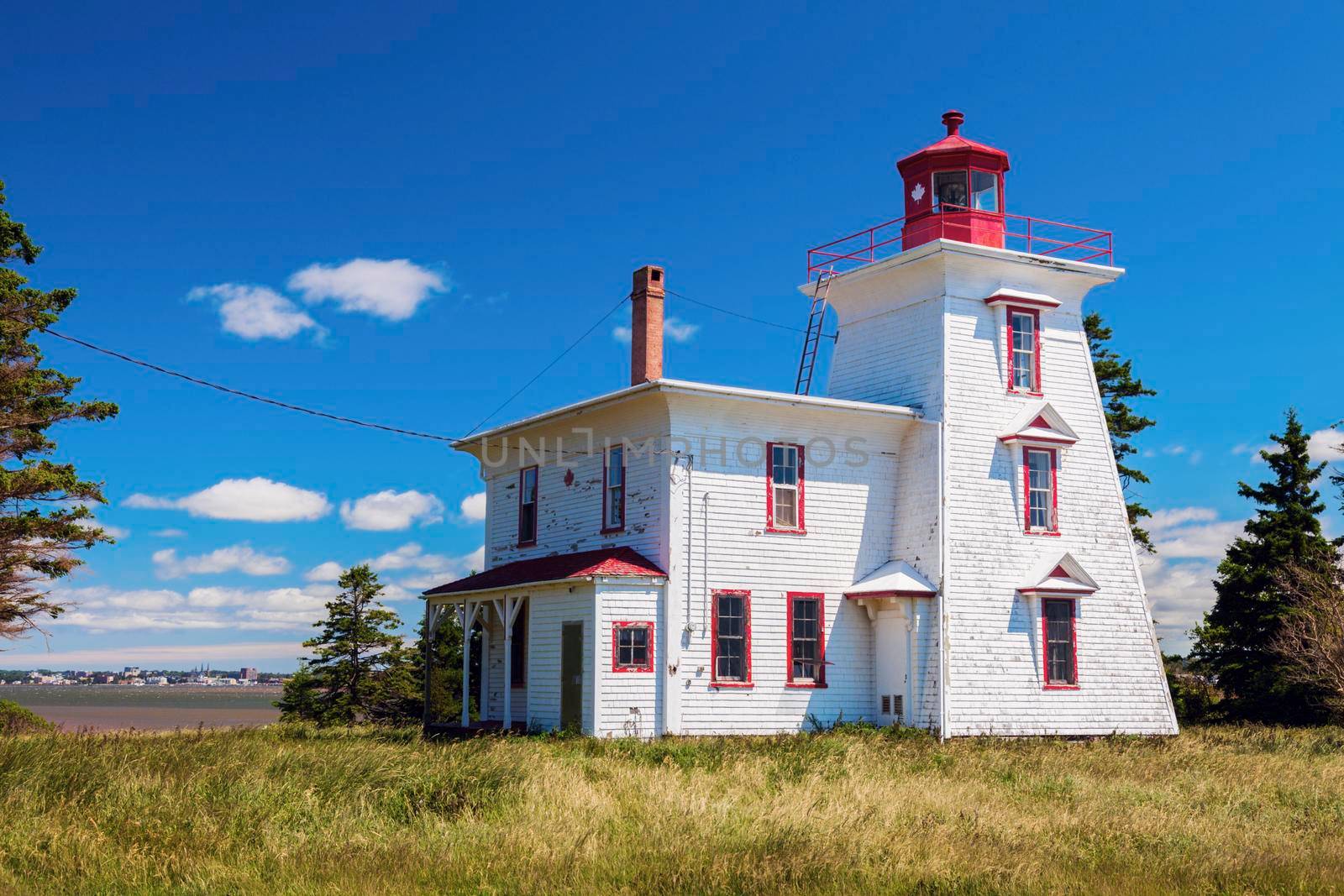 Blockhouse Point Lighthouse on Prince Edward Island and Charlottetown panorama. Prince Edward Island, Canada.