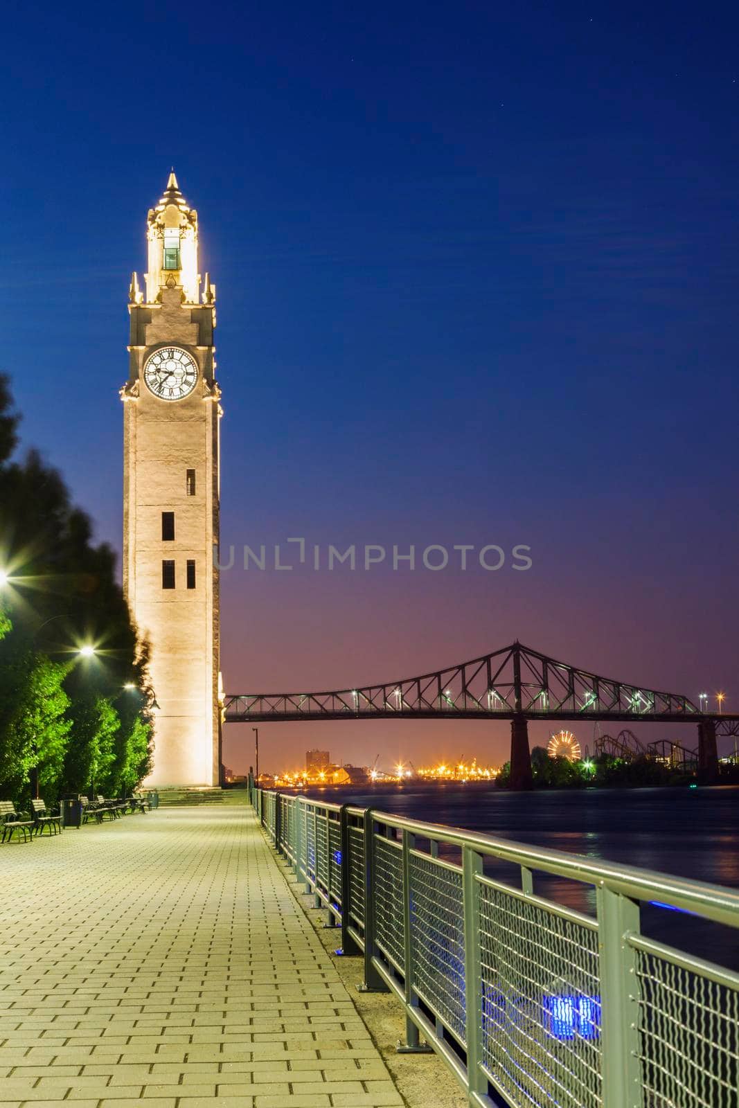 Montreal Clock Tower and Jacques Cartier Bridge. Montreal, Quebec, Canada.