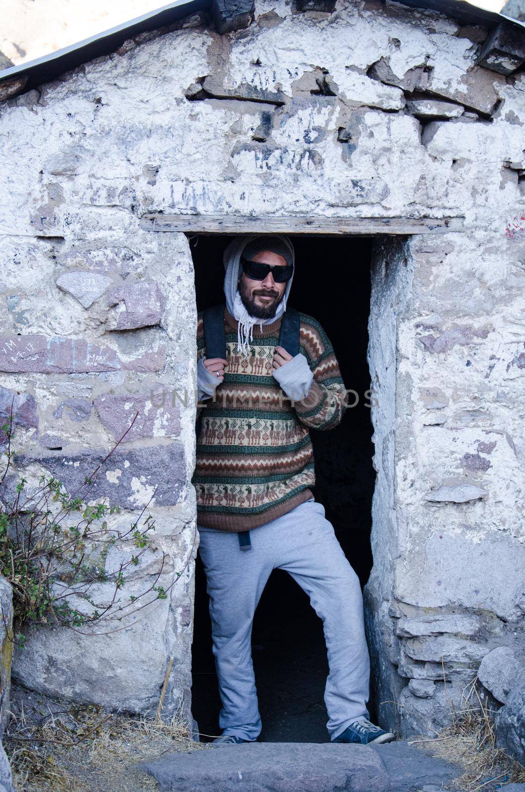 Traveler man with glasses posing at Daniel Russo's house in Marcahuasi located east of Lima - Peru