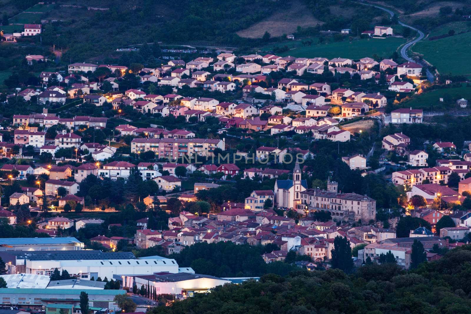 Millau panorama at night - aerial view. Millau, Occitanie, France.