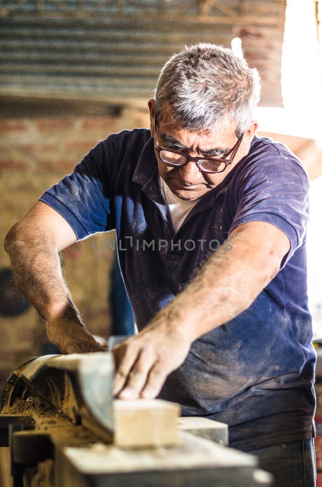 Carpenter tools on wooden table with sawdust. Cutting a wooden plank