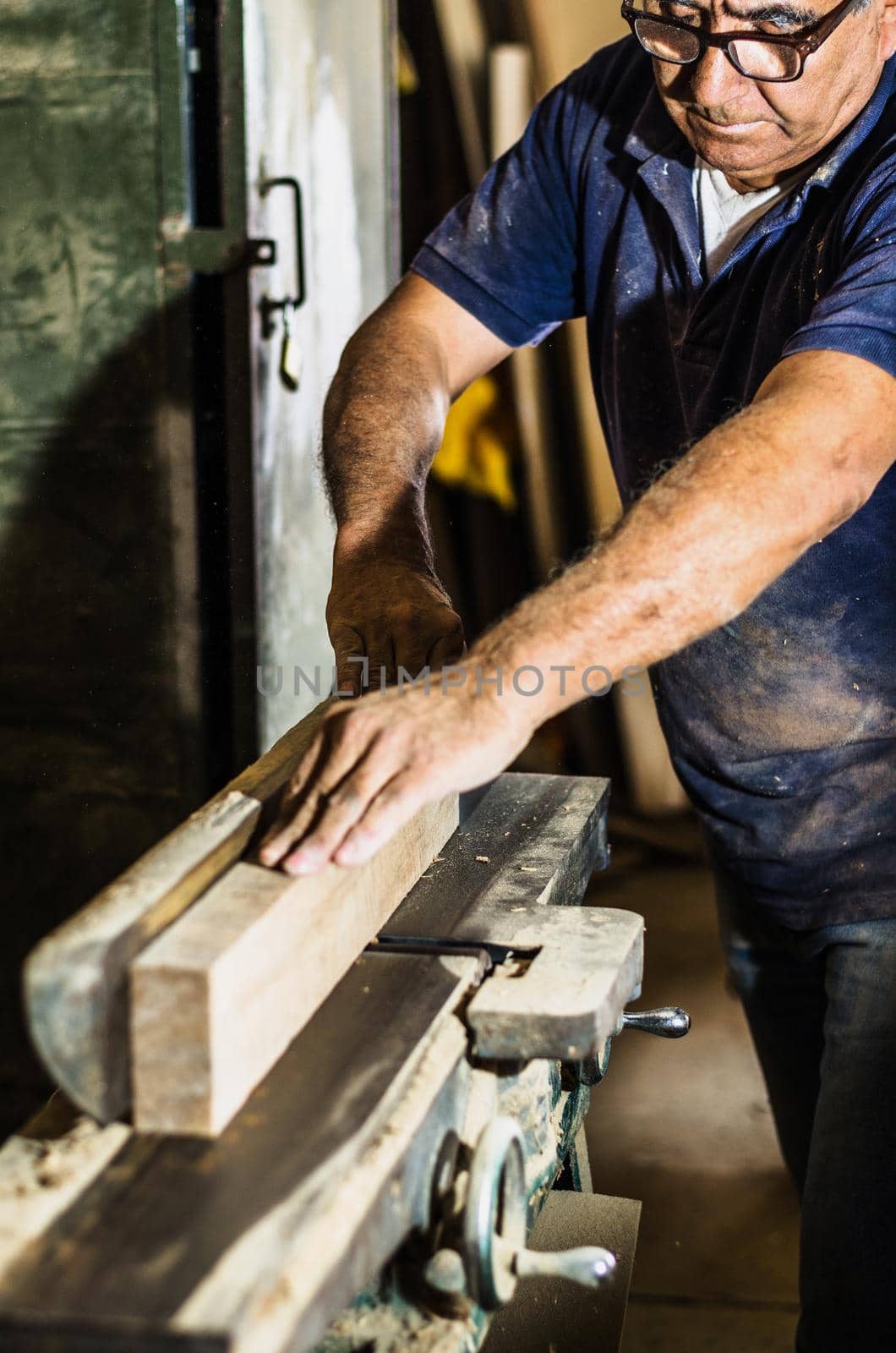 Carpenter tools on wooden table with sawdust. Cutting a wooden plank