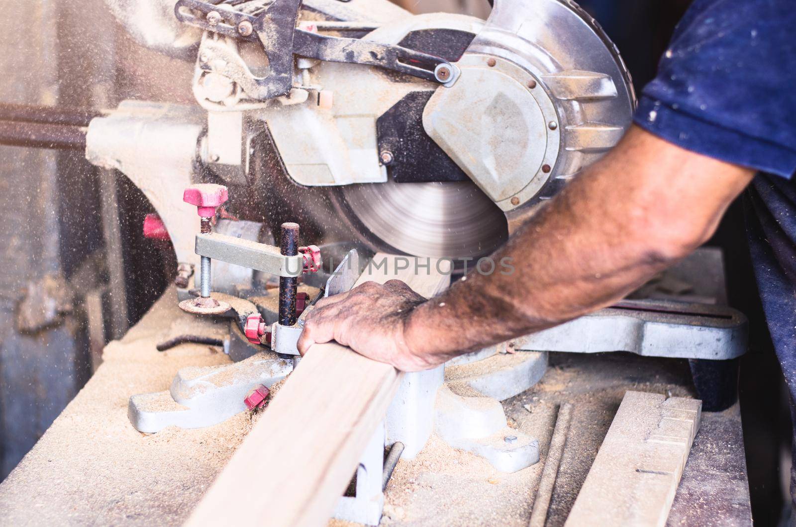 Circular saw for cutting boards into the hands of the professional carpenter, construction and home renovation, repair and construction tool