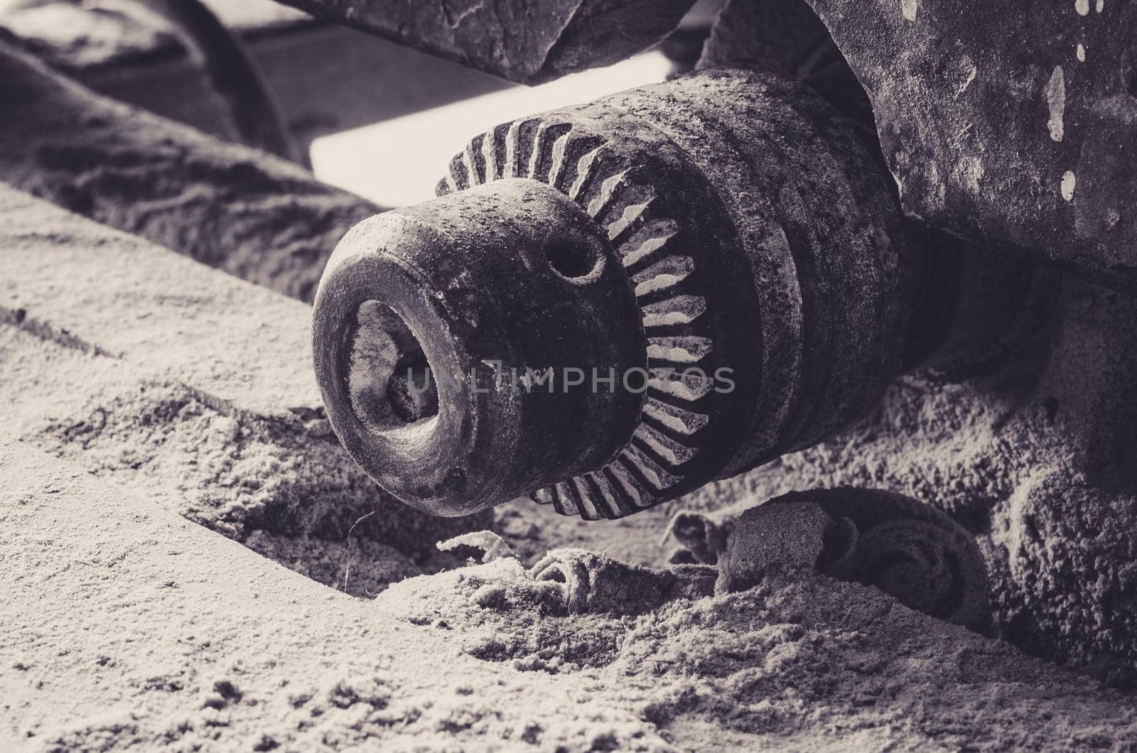 Close-up of gears of an old wood cutting machine. Industrial theme