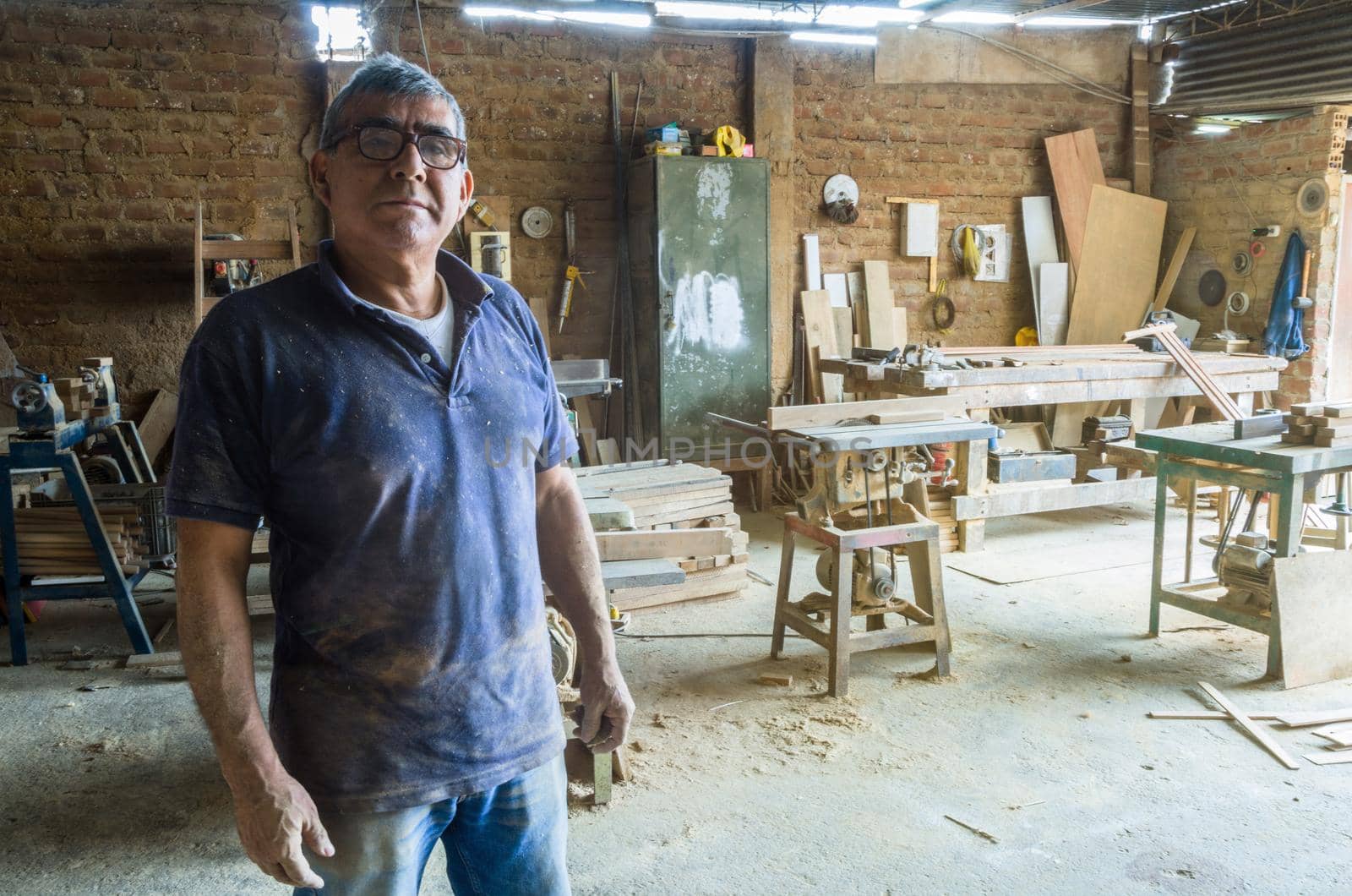 Portrait of senior carpenter in his workshop