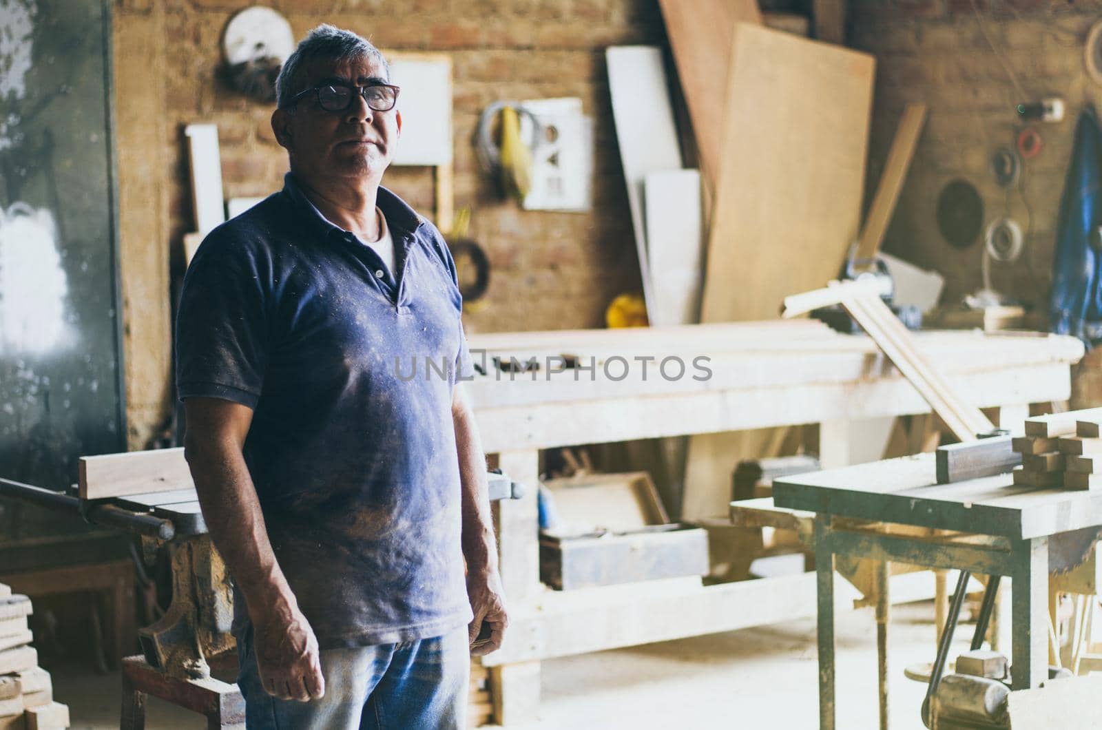 Portrait of senior carpenter in his workshop