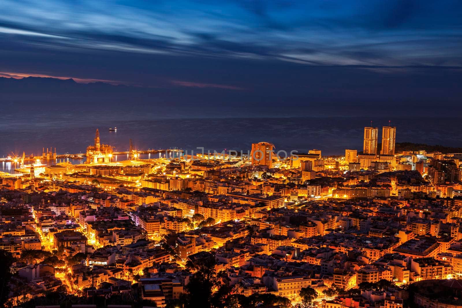 Panorama of Santa Cruz de Tenerife. Gran Canaria silhouette in the background. Santa Cruz de Tenerife, Tenerife, Spain.