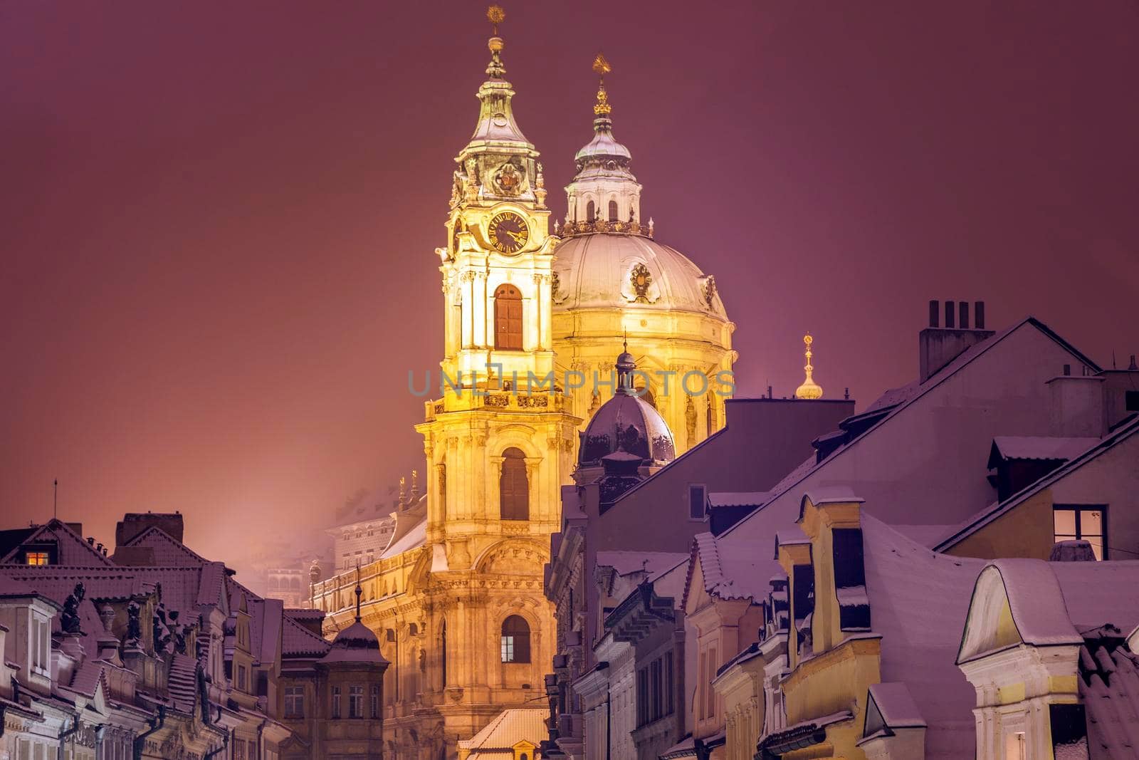 Winter in Prague - city panorama with St. Nicholas Church. Prague, Bohemia, Czech Republic.