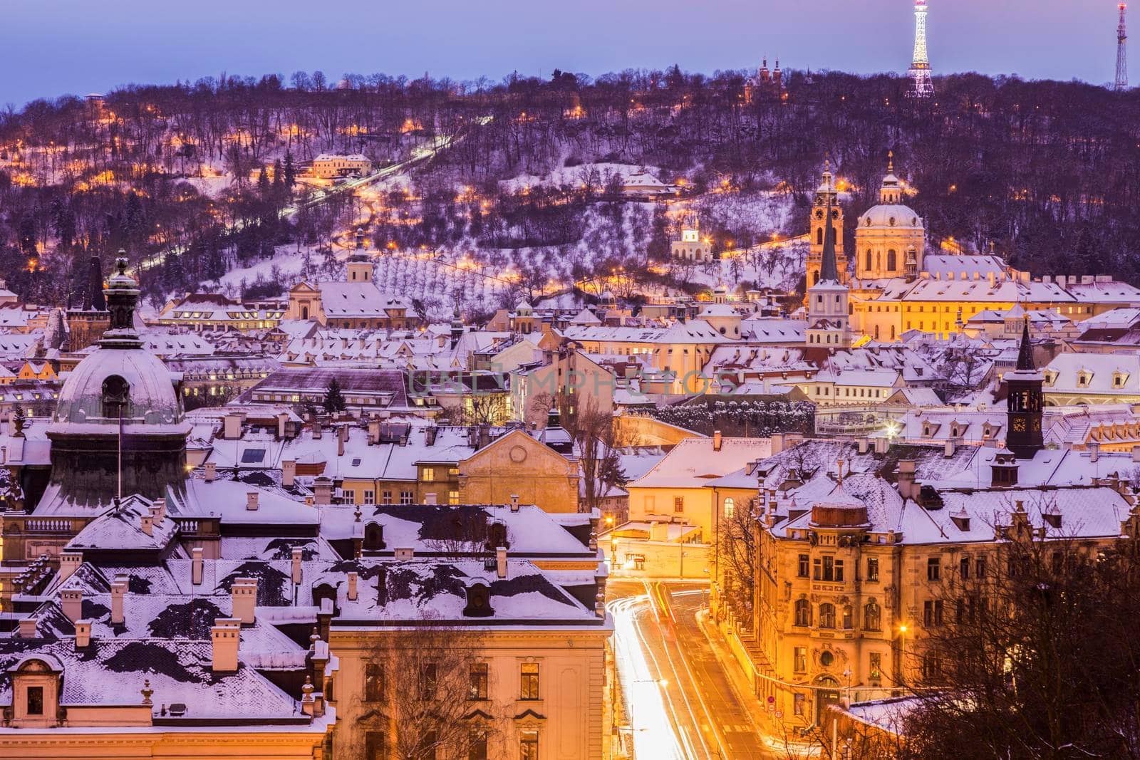 Winter in Prague - city panorama with St. Nicholas Church. Prague, Bohemia, Czech Republic.