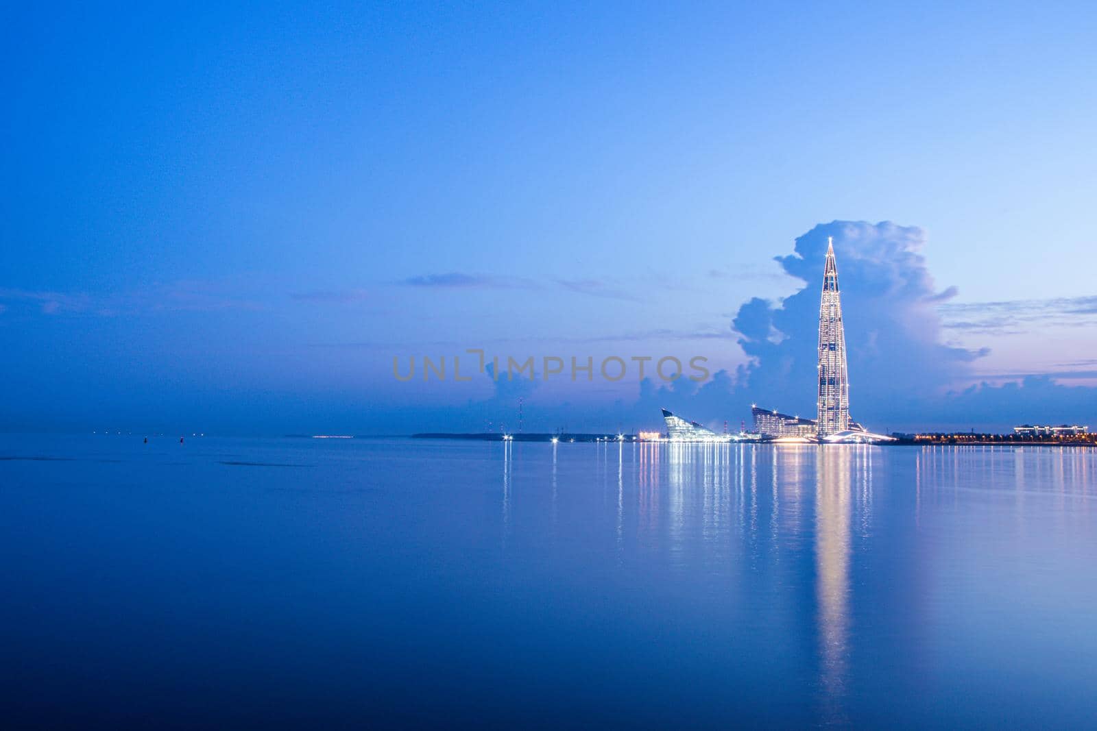 Lakhta center in Saint Petersburg at night. Modern high building. White night. Long-exposure photos. Calm and serene. Article about modern buildings. Cover for printed products. Russia, Saint Petersburg June 19, 2020