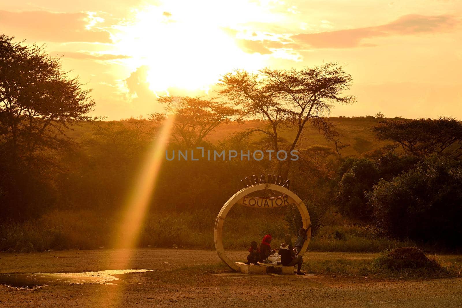 A Ugandan family on the equator line, Uganda